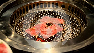 Slice sirloin on hot charcoal grill pan.