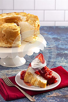 Slice of Strawberry Short Cake Made with Angel Food Cake and Strawberry Sauce