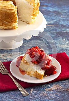 Slice of Strawberry Short Cake Made with Angel Food Cake and Strawberry Sauce