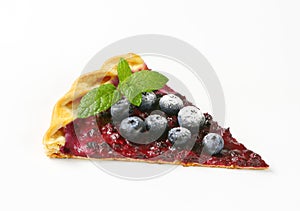 Slice of thin blueberry tart