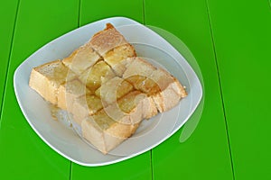 Slice toast with butter sweetened condensed milk and sugar