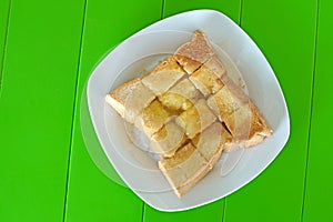 Slice toast with butter sweetened condensed milk and sugar