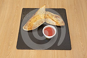 slice of toasted bread. Depending on the country, it can be called