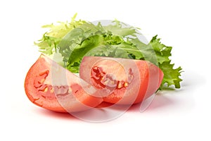 Slice tomato with green fresh salad, isolated on white background