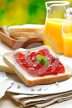 Slice of white bread and strawberry jam