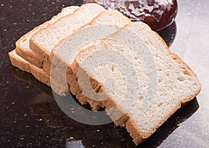 Slice white bread on wooden background