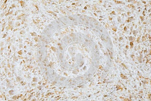 Slice of white whole wheat background macro.