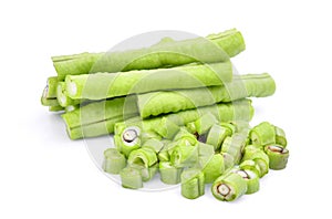 Slice of yard long bean on white