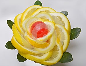 Slice yellow slices  lemon and red candy in the center photo