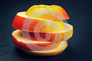 Sliced apple on black background