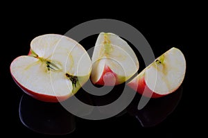 Sliced apple on a black background.