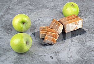 Sliced apple pastille on a stone serving board.