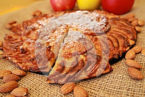 Sliced apple pie with nuts