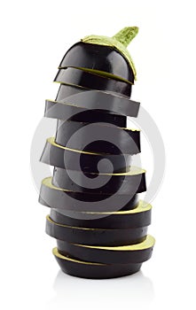 Sliced aubergine, eggplant arranged stack, pile isolated white