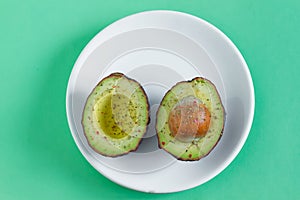 Sliced avocado with spices ready to eat photo