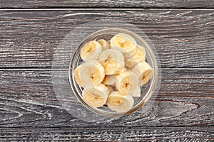 sliced banana bowl on wood