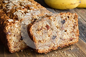 Sliced banana bread loaf with walnuts and oats