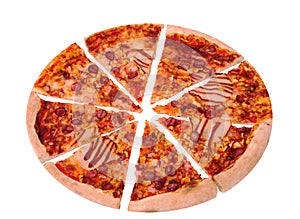 Sliced BBQ italian pizza with ham, bbq sauce, bacon and salami, isolated on white, angle view