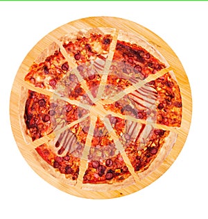 Sliced BBQ pizza with ham, bbq sauce, bacon and salami on a round wooden platter, isolated on white, top view