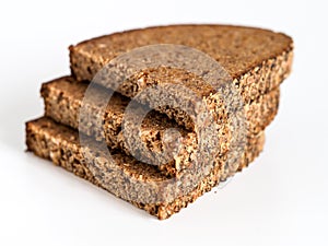 Sliced black bread on white background