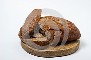 Sliced black bread on a white plate. Borodino bread. Homemade baking.