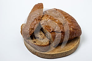 Sliced black bread on a white plate. Borodino bread. Homemade baking.