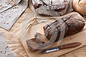 Sliced black bread on a wooden table