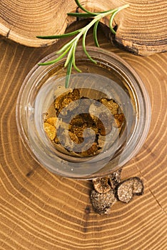 Sliced black truffle in olive oil