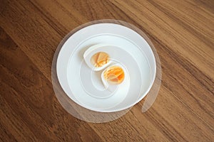 Sliced Boiled egg in white ceramic plate