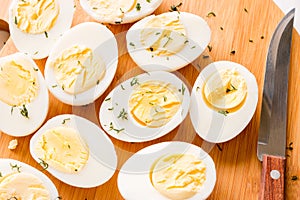 Sliced boiled eggs with dill closeup