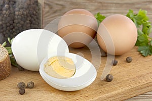 Sliced boiled eggs, with parsley leaves. Cooking a salad with boiled eggs