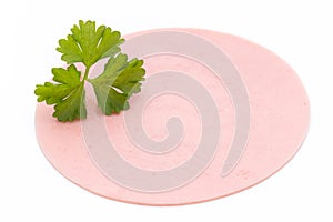 Sliced boiled ham sausage isolated on white background, top view