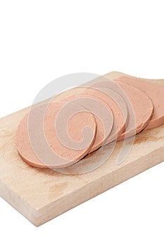 SLICED BOLOGNA ON THE KITCHEN CUTTING BOARD