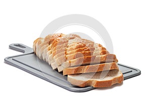 Sliced bread on breadboard