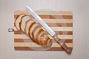 Sliced bread on breadboard