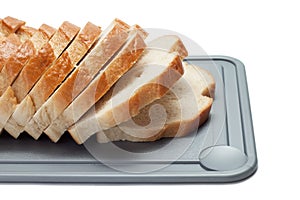 Sliced bread on breadboard isolated
