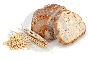 Sliced bread loaf with wheat ears and grains