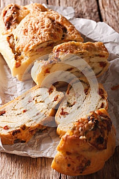 Sliced bread stuffed with cheese and bacon and dried tomatoes cl