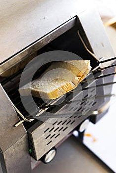 Sliced bread in Toaster for breakfast