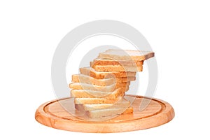 Sliced bread on a wooden chopping board isolated