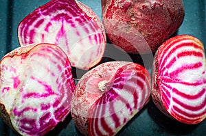 Sliced Candy Cane Beets, also known as Chioggia Beets, arranged on a baking tray.