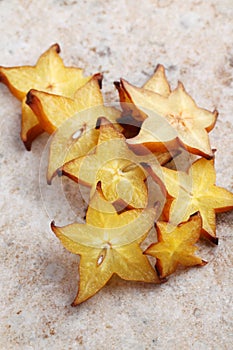 Sliced carambola, or starfruit, on a marble surface