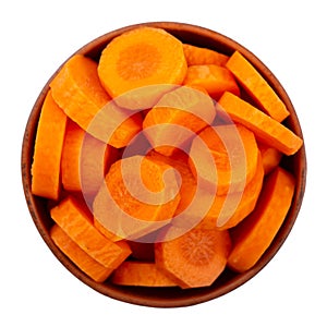 Sliced carrots in a bowl Isolated on white background. Fresh cut crisp pieces of  carrots, a root vegetable with orange color.