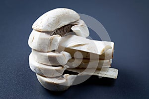 Sliced champignon on a dark background