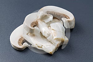 Sliced champignon on a dark background