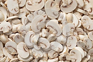 Sliced champignons, Button mushrooms,close up full frame as background