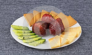 Sliced cheese on a plate.