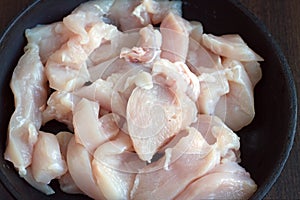 Sliced chicken diet meat in pan while cooking
