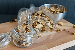 Sliced, chopped and dried various mushrooms in preserving glass