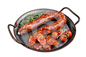 Sliced Chorizo sausage, slices of dry cured pork with herbs and spices. Isolated on white background. Top view.